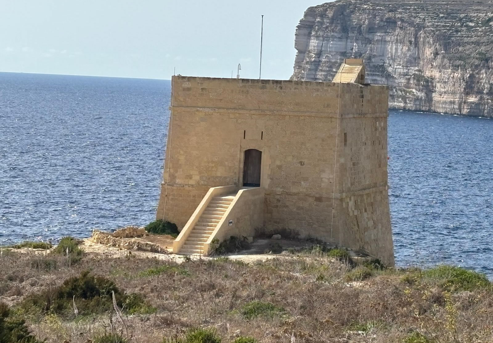 Xlendi Tower overlooking Xlendi Bay in Gozo